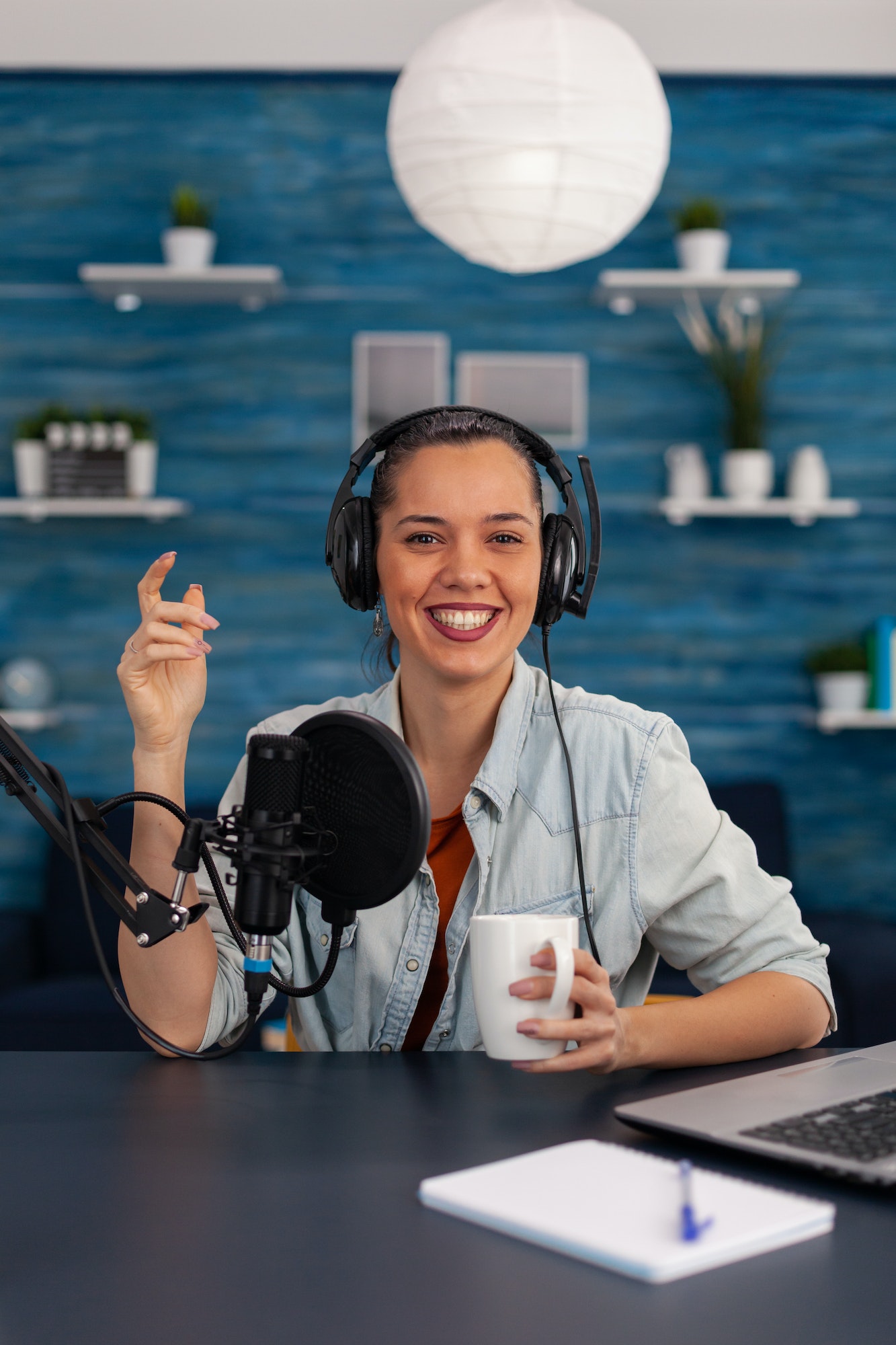 portrait-of-happy-woman-facing-camera-recording-in-home-studio.jpg portrait-of-happy-woman-facing-camera-recording-in-home-studio.jpg